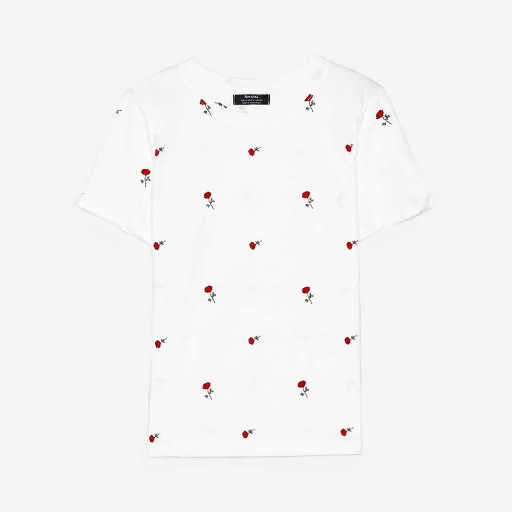 Rose covered white tee.